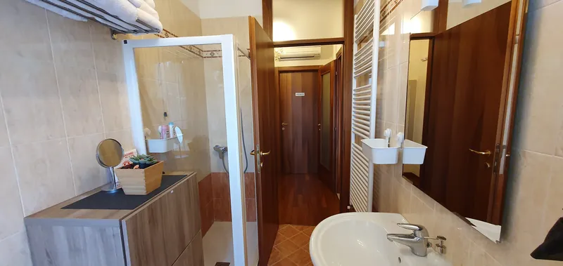 Bathroom with shower and cabinet